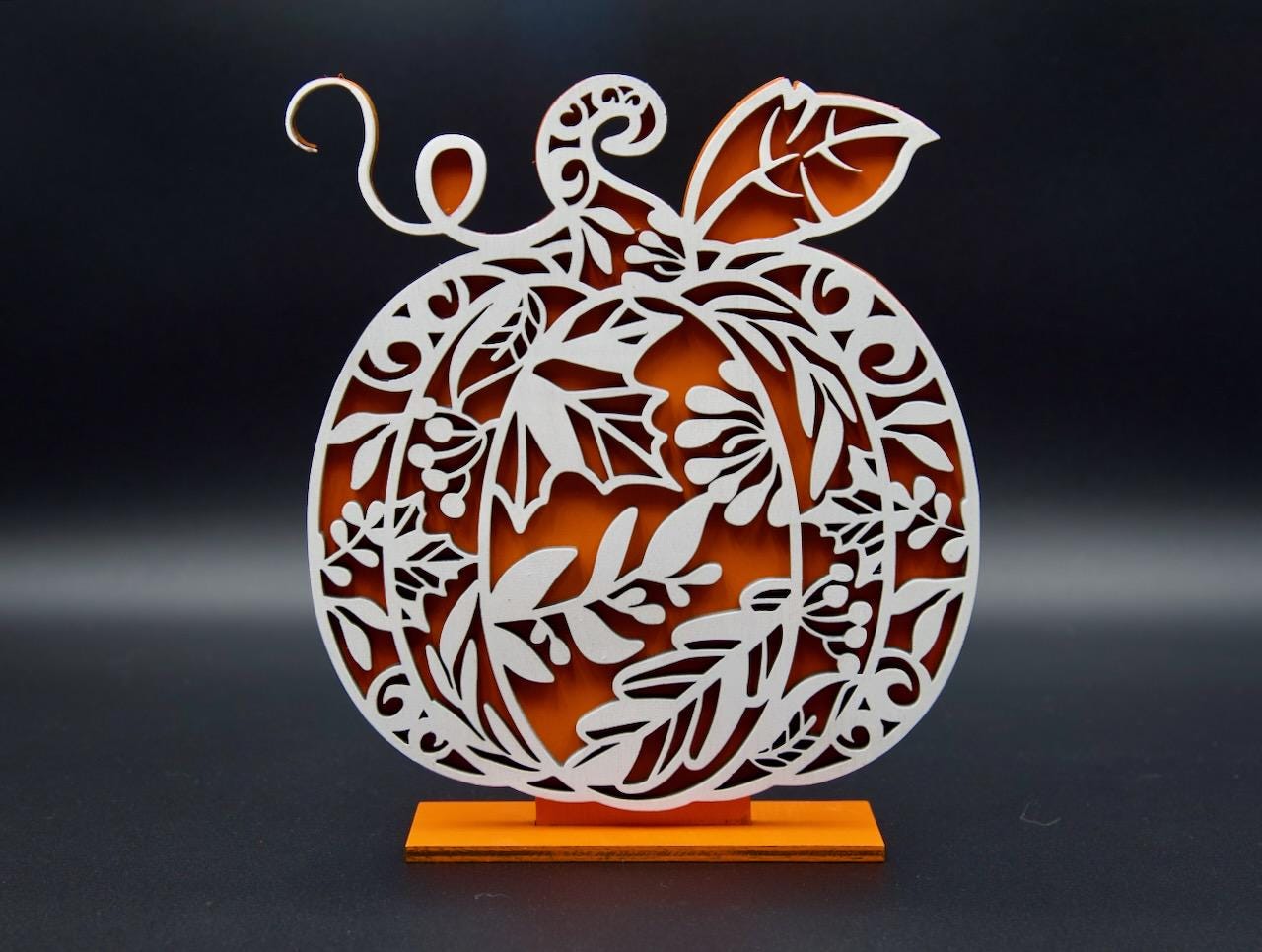 Wooden pumpking decoration. Beautifully crafted ornamental design.